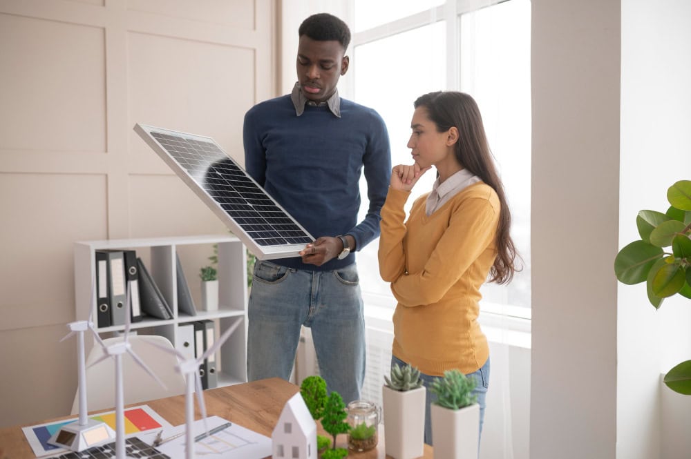 team discussing free solar panels